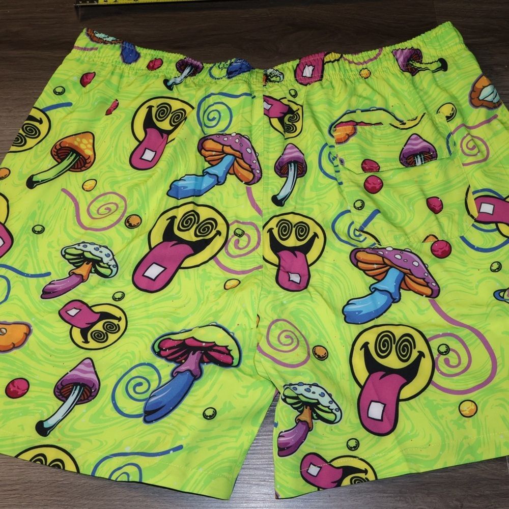 Men's Neon Am I Tripping Shorts featuring a psychedelic mushroom and smiley face